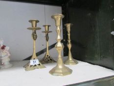 2 pairs of brass candlesticks.