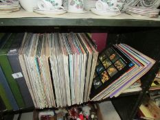 A shelf of LP records, (in excess of 100).