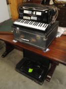 An electric hand crafted Gioletti piano accordion with bass expander unit.