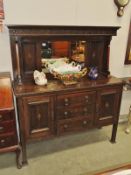 An oak arts and crafts sideboard.