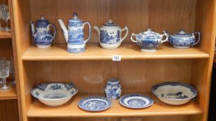 2 shelves of blue and white including teapots, coffee pots etc.