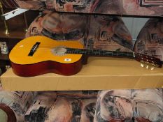 An Encore six string classical guitar (as new) with a 'Quick Tone' guitar tuner.