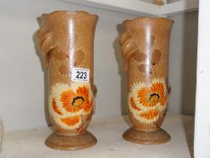 A pair of Flaxton vases with floral design.