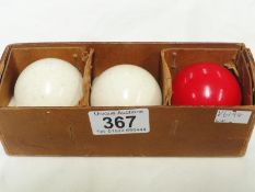 3 vintage billiard balls.