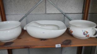 A bed pan and 2 chamber pots.