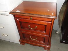 A small mahogany 2 drawer chest.