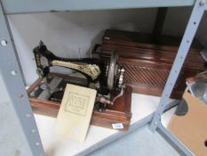 A Singer sewing machine with booklet.