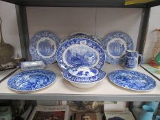 A shelf of blue and white table ware.