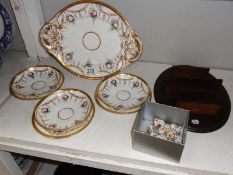 A 2 handled porcelain dish, thimbles on rack, plates and saucers.