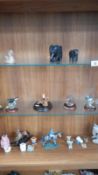 3 shelves of assorted figures.