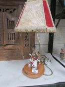 A table lamp with bird figure.