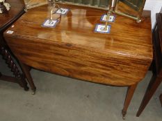 A mahogany Pembroke table.