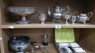 2 shelves of silver plate.