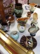 12 small items of German pottery.