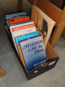 A box of aviation books.