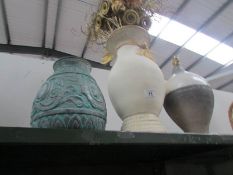 A lamp base and 5 vases.