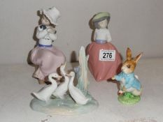3 NAO figures and a Beatrix Potter figure.