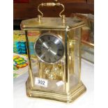 A brass cased clock,
