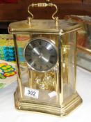 A brass cased clock,