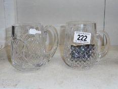 A pair of Waterford cut glass tankards.