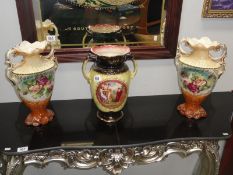 A pair of vases and one other.