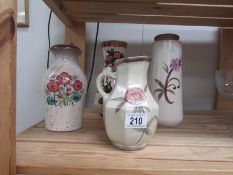 4 floral decorated German pottery vases.