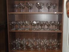 3 shelves of wine glasses.