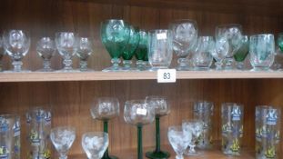 2 shelves of assorted drinking glasses.