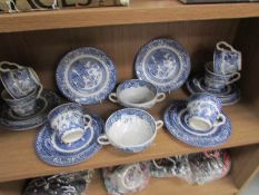 A shelf of blue and white tea ware.