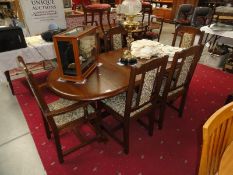 A good quality oak extending dining table and 6 chairs.