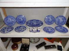 A shelf of blue and white table ware.