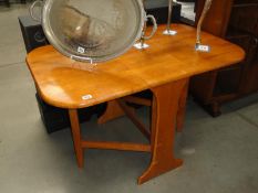 A modern drop leaf table.