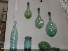 4 unusual glass bottles and 2 other glass bottles including O.T. Ltd.