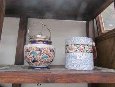 2 pottery biscuit barrels.