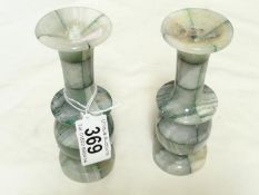 A pair of marble candle holders,.