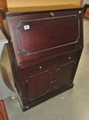 A mahogany effect bureau.