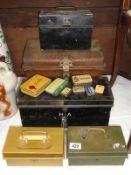 A mixed lot of old tins including deed box and cash tins.