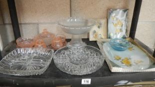 A shelf of assorted glassware.