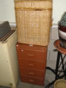 A 4 drawer chest containing tool compartments and some tools and a wicker basket