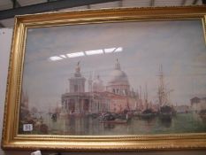 A glazed and framed picture of Venice