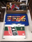 A large quantity of unboxed die-cast cars etc including carry cases