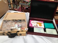 3 wooden boxes of ear piercing equipment and earring studs etc