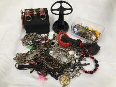 A box of gothic themed costume jewellery and a pair of opera glasses
