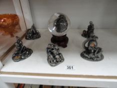 6 Dark Secrets figurines and a glass orb on stand