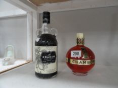 A bottle of unopened The Kraken Black Spiced Rum and an unopened bottle of Chambourd