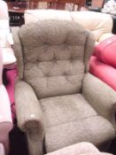 An electric reclining armchair