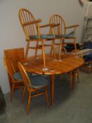 A pine table and 4 chairs