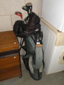 A set of golf clubs and bag