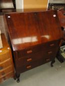 A bureau desk with 3 drawers