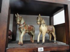 2 matching wooden horses with painted decoration a/f